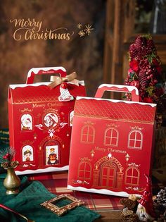 two red christmas bags sitting on top of a table