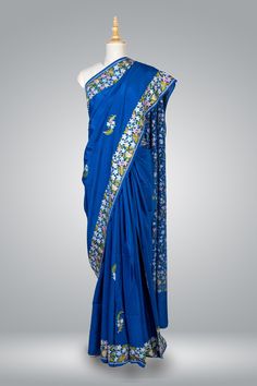 Royal Blue Pure Crepe Kashmiri Saree, Aari Embroidered Saree, Indian Saree Elevate your ethnic wardrobe with this exquisite Royal Blue Kashmiri Saree, meticulously crafted from pure crepe fabric to provide an unparalleled combination of luxury and comfort. The mesmerizing Aari embroidery adorning the saree showcases the rich heritage and skilled artistry that has become synonymous with Kashmiri handcrafts. The enchanting multicolored embroidery, carefully Embroidered into small floral motifs, br Designer Embroidered Blue Saree Fabric, Designer Blue Embroidered Saree Fabric, Blue Embroidered Saree Fabric For Designer Wear, Bollywood Blue Embroidered Fabric In Traditional Drape, Blue Embroidered Saree For Designer Wear, Bollywood Style Blue Embroidered Fabric In Traditional Drape, Katan Silk Saree With Intricate Embroidery, Blue Embroidered Fabric For Designer Wear, Blue Saree With Resham Embroidery In Traditional Drape