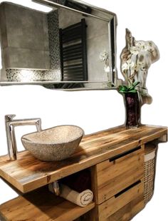 a bathroom with a sink, mirror and towel rack