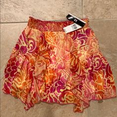 New With Tags. Polyester Cute Multicolor Spring Skirt, Playful Summer Skirt, Playful Beach Skirt For Summer, Playful Flowy Skirt For Spring, Playful Ruffled Summer Skirt, Playful Stretch Skirt For Spring, Stretch Pink Skirt For Vacation, Stretchable Pink Skirt For Vacation, Floral Print Skirt