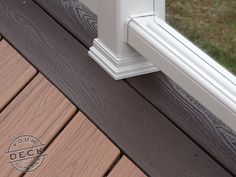 a close up of a window seal on a wooden deck