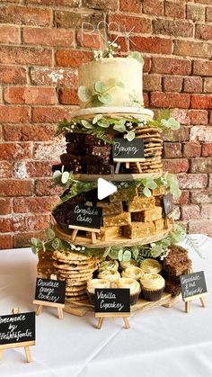 a cake and cupcakes are stacked on top of each other