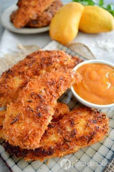 some fried food on a plate with dipping sauce