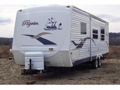 an rv is parked in the middle of a field