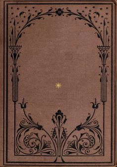 an old book with black and gold designs on the front cover, in brown paper