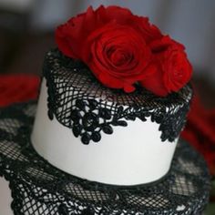 two tiered cake with black lace and red roses