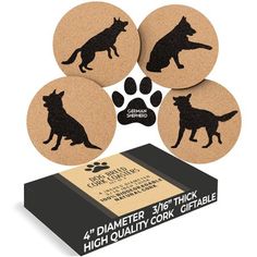 four cork coasters with black dog images on them and a paw print in the middle