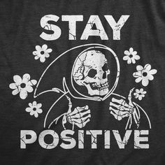 a t - shirt that says stay positive with a skeleton holding a flower in it