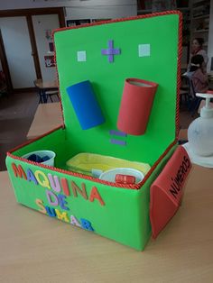 an open green box sitting on top of a table