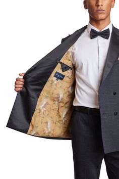 For all your special occasions, this double-breasted, peak lapel tuxedo jacket with side vents and a complimentary pocket square will be the perfect choice. Designed with a poly rayon stretch blend, this jacket provides both comfort and style. To complete the look, pair it with its Sloane tux pants and a satin bow tie.PRODUCT DETAILS: style 6468J slim fit suit jacket double-breasted jacket peak lapel complimentary pocket square side vents poly-rayon stretch blend dry clean only imported Fitted Blazer With Pocket Square And Suit Collar, Winter Black Tuxedo With Pressed Crease, Black Tuxedo With Double Button Closure, Black Tuxedo With Double Button Closure For Formal Events, Black Tuxedo With Double Button Closure For Formal Occasions, Winter Black Tie Tuxedo With Notch Lapel, Double Breasted Tuxedo Suit With Welt Pockets, Notch Lapel Blazer For Black Tie Winter Events, Black Double-breasted Tuxedo For Formal Occasions