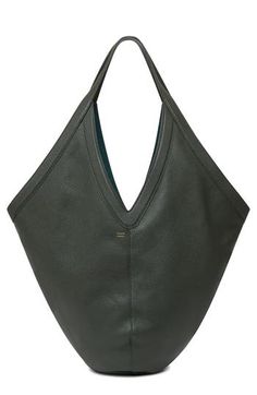 A sculptural shape subtly alludes to the 'M' in Mansur on a pebbled-leather shoulder bag detailed with a soft suede lining and slender tie closure. Tie closure Shoulder straps Suede lining Leather Made in Italy Designer Handbags Green Leather Hobo Bag For Evening, Modern Textured Leather Hobo Bag For Shopping, Modern Sculptural Leather Bags, Woman Bags Handbags, Mansur Gavriel, Leather Hobo Bag, Fabric Gift Bags, Fabric Gifts, Leather Hobo