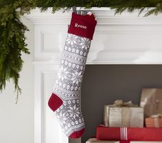 a christmas stocking hanging from a mantel