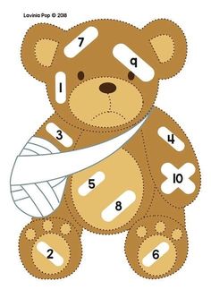 a teddy bear with bandages on it's face and the numbers cut out in half