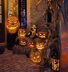 pumpkins are lit up in front of a house