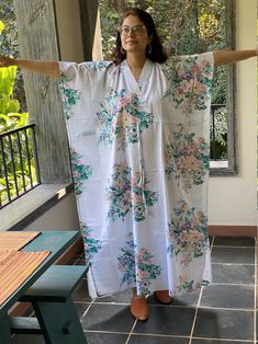 I made this Kaftan from a beautiful floral pattern in 100% mulmul cotton. Mulmul is a very fine variety of cotton which is extremely soft and it gets softer with every wash. It is so free flowing, that it will make you feel as if you aren't wearing anything at all ;) The beauty of the Kaftans is they will fit everyone so no need to worry about the size et all. All my Kaftans have deep necks(11-12 inches) so will fit all head sizes. However, the length of my kaftans will vary. I make all my kafta Cotton Sleepwear With Kimono Sleeves For Home, White Sleepwear With Kimono Sleeves For Loungewear, Cotton Sleepwear With Kimono Sleeves For Relaxation, Printed Cotton V-neck Kimono, White Floral Print Sleepwear For Relaxation, White Floral Print Kimono For Loungewear, White Printed Kimono For Loungewear, White Spring Kimono For Relaxation, Cotton V-neck Kimono With Floral Print