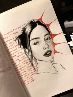 a drawing of a woman's face on top of a book