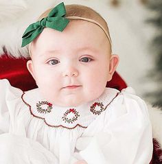 "Baby girl first Christmas outfit is a very special baby girl clothes item. Christmas dress and toddler smocked dresses the perfect Christmas outfit. Smocked dress is white and is smocked in Christmas design. To see other similar items, please visit our store: www.zulikidsclothing.com The listing photos contain a  size chart as well as font choices.   Please leave details and phone number in the \"note to seller\" box at checkout.   Shop Policies Can be found here:   https://www.etsy.com/shop/ZuliKids?ref=seller-platform-mcnav#policies By ordering from my shop, you're acknowledging you agree to this policy." Baby Christmas Dresses, Girls Smocked Christmas Dress, Baby Girl First Christmas, Toddler Girl Christmas Dresses, Smocked Christmas Dresses, Girl Christmas Outfit, Smocked Baby Clothes, Toddler Christmas Outfit, Toddler Christmas Dress