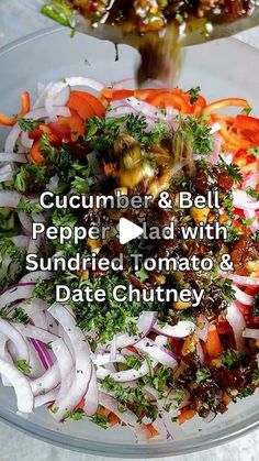 a bowl filled with lots of different types of food next to a plate full of onions and carrots