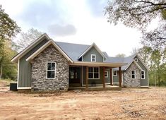 a house that is sitting in the dirt