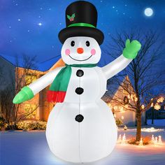 a large inflatable snowman with a hat and scarf