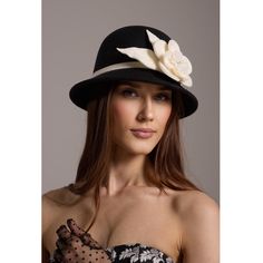 Our modern reinterpretation of the 1920s Scala hat, designed for the contemporary woman who appreciates timeless elegance with a hint of glamour. This sophisticated accessory offers a comfortable fit and a sleek monochrome color palette, perfect for elevating any ensemble with effortless style. Woven pearl bag with a cotton pouch inside. Wipe clean with a cloth. Chic Short Brim Fedora For Kentucky Derby, Chic Brimmed Fedora For Kentucky Derby, Chic Fitted Fedora With Brim, Chic Fitted Brimmed Fedora, Chic Fitted Top Hat For Winter, Chic Adjustable Brimmed Top Hat, Chic Fitted Hats With Curved Brim, Elegant Flat Brim Fedora For Spring, Chic Fitted Fedora Hat