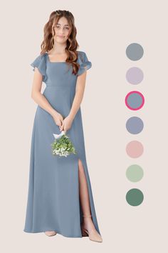 a woman in a blue dress holding a bouquet and standing next to a color chart