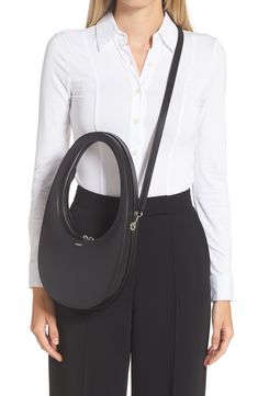 A wearable, functional icon, this calfskin bag has a geometric silhouette inspired by the minimalist 'swipe' indicator found on many of today's phones. 7"W x 14"H x 2"D Two-way top-zip closure Top carry handle; removable crossbody strap Leather Made in Italy Designer Handbags Modern Shoulder Bag With Round Handle For Business, Modern Shoulder Bag With Detachable Handle, Modern Business Shoulder Bag With Dust Bag, Modern Shoulder Bag For Business, Modern Shoulder Bag With Round Handle, Modern Shoulder Bag With Round Handle For Work, Modern Workwear Bags With Round Handle, Modern Round Handle Bags For Work, Modern Shoulder Bag For Work