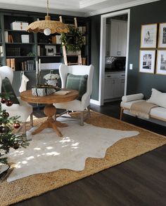 a living room filled with furniture and a christmas tree