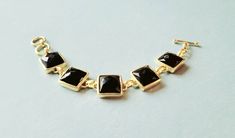 This Beautiful Black Gemstone Bracelet is made with Brass which has been Gold plated. Elegant and Bold at the same time, this luxury bracelet will be a great addition to your jewelry collection, and an accessory that would match many outfits. This statement bracelet with quality craftsmanship is ready to help you dazzle at your next special event! Each bracelet is carefully handcrafted and therefore each item may vary ever so slightly, as well as minor imperfections that only add to the beauty o Black Gold Bracelet, Bracelet Party, Prom Gift, Luxury Bracelet, Black Bracelet, Bridal Bangles, Wedding Bridal Jewellery, Jewelry Statement, Stackable Bracelets