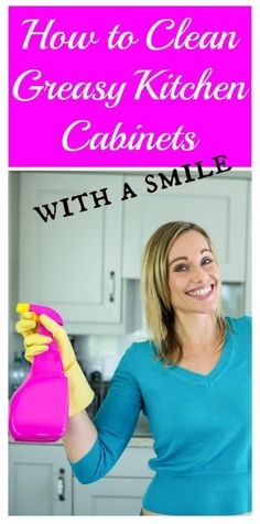 a woman in blue shirt holding up a pink cleaning spray bottle with the words, how to clean greasy kitchen cabinets with a smile