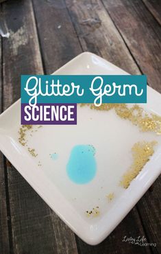 a white plate with blue and gold glitter on it that says glitter germ science