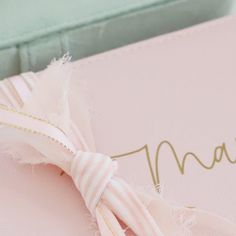 a close up of a pink box with a bow on it's headband