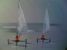 two small sailboats in the water on a cloudy day