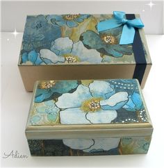 two boxes decorated with blue and white flowers