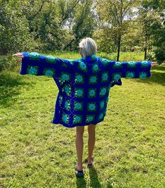 Introducing my latest creation! Upcycled the prettiest vintage royal blue aquamarine rose crochet blanket into this cozy, one of a kind crochet cardigan. Measurement: Chest is approximately 48" Overall length is approximately 35" Sleeve length is 23" Unisex design. Model is 5'10 for reference. This statement jacket was made with all of my heart, for any human, anywhere, that may be attracted to its vibe! My intention is that the piece will amplify the divine nature of your inner being. ✨🌙 Blue Granny Square Cardigan For Fall, Blue Bohemian Knitted Cardigan, Bohemian Knitted Blue Cardigan, Fitted Crochet Blue Cardigan, Fitted Blue Crochet Cardigan, Handmade Blue Cardigan For Spring, Spring Blue Crochet Cardigan, Blue Crochet Cardigan For Spring, Handmade Bohemian Blue Outerwear