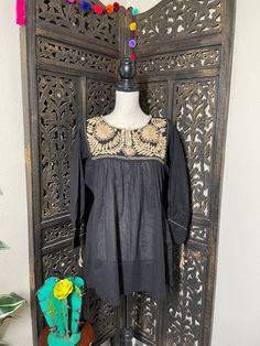 A very Nice and Gorgeous Brown Gauze Blouse w/Gorgeous Embroidered Flower designs. The design work is simply gorgeous. Perfect for your ultimate weekend look, beach, casual look or just to impress your friends with this gorgeous piece. You will Love it! Blouse STYLE DETAILS Overview * Round neck * Handmade work * 3/4 Long sleeves fit & sizing * Medium fabric & care * hand wash * delicate care * hang dry NOTE: Belt is not included. Please email me your questions before buying email me TOD Vacation Embroidered Blouse With Relaxed Fit, Embroidered Relaxed Fit Blouse For Vacation, Vacation Embroidered Relaxed Fit Blouse, Floral Embroidered Tunic Top For Beach, Embroidered Relaxed Fit Blouse For Beach, Beach Embroidered Relaxed Fit Blouse, Cotton Embroidered Top For Vacation, Black Floral Embroidered Blouse For The Beach, Beach Blouse With Intricate Embroidery