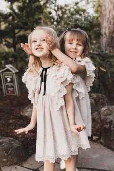 🌸 Introducing our latest masterpiece from the talented designer Nadiia Kholina, exclusively for "Mini Me and Mama"! 🎀 This enchanting light beige dress is a vision of elegance, featuring cascading layers of lace on flutter sleeves and an intricately embroidered cream mesh overlay. The delicate scalloped hem and classy black velvet trim with a bow on the neckline add a touch of sophistication. ✨ Made with love and care, this dress is crafted from a blend of 50% cotton and 50% polyester on the outside, while the lining is 100% organic cotton for your little one's comfort. 💕 Keep it looking its best with warm water machine wash, and remember, it's a piece of art that deserves gentle care. Available now! #GirlsFashion #NadiiaKholinaDesigns #MiniMeAndMama #minimeandmama #vintage #dress Light Beige Dress, Cascading Layers, Water Machine, Beige Dress, Beige Dresses, Velvet Trim, Mesh Overlay, Lace Ruffle, Scalloped Hem