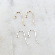 1 Pair Dainty Simple Ear Wire Earring Wires EARRINGS ARE NOT EXCHANGEABLE OR REFUNDABLE -loop can open Quantity : 2 pieces - 1 pair Material : Sterling silver or 14K Gold Filled Dimension : 20mm x 16mm Surface : shiny silver, shiny gold Please ask for larger quantities if would like more than what is currently listed! ★ Shop Bulk Discount Codes★ -Spend $50-$100 get 10% OFF Use Code: BEAD10 -Spend $101-$150 get 15% OFF Use Code: BEAD15 -Spend $151-$200 get 20% OFF Use Code: BEAD20 -Spend $201 and Wire Earring, Earring Wires, Gold Filled Earrings, Wire Earrings, Metal Charm, Photo Bracelet, Shiny Silver, Custom Necklace, Discount Codes