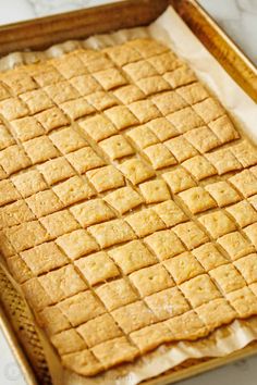 a pan filled with crackers sitting on top of a counter