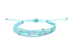 "A pastel blue waterproof string bracelet featuring holographic glass seed beads. Inspired by icicles and fresh snow... ❄️ ❀ Made with waxed polyester cord and TOHO glass seed beads ❀ Adjustable waterproof bracelet fits most adult wrists (measures 11\" at longest) ❀ Because all bracelets are made to order, we can customize length to accommodate smaller or larger wrists! Just leave a note with your order specifying your custom measurements. ☺︎ We try to display product colors as close to life as possible. However, all computer monitors are different and so there might be slight color variations from screen to screen.  CARE INSTRUCTIONS  This bracelet is made with waxed polyester cord, so it is fully waterproof!   SHIPPING >> Domestic orders ship USPS Ground Advantage, and typically arrive w Waterproof Bracelet, Surfer Bracelets, Pastel Sky, Winter Inspired, Seed Bead Bracelet, Bleu Pastel, Boho Bracelet, String Bracelet, Seed Bead Bracelets