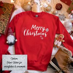 Merry Christmas unisex sweatshirt. A great sweatshirt for this holiday season! Snowflakes & ornament can be white, silver glitter, or red. This option can be made in the personalization section. If interested in other colors, send me a message, I may be able to add.  The equipment and supplies used to make my products are all commercial grade quality. Each design is made with one of the best vinyl in the industry and cut with a commercial grade plotter. It is then pressed with a high-pressure co Colorful Sweatshirt, Santa Paws, Holiday Sweatshirt, Sweatshirt Christmas, Christmas Floral, Custom Tees, Holiday Shirts, Holly Jolly, Fall Sweaters