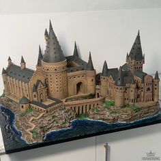 a model of a castle is shown on the wall