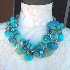 I got the inspiration for this collar from a picture of Princess Sophia wearing a Famous Designer Necklace. Instead of the Classic Pearls I chose to make it with large acrylic beads and other turquoise beads that provide drama but no WEIGHT! I also used copper glass beads. It makes a very bold statement. Measures - You Choose. It has a lovely magnetic clasp for easy attachment.. Get ready for compliments!!! This necklace has The Iris Apfel Wow Factor for sure! Free US Shipping! Are you ready for Bulky Necklaces, Beaded Baubles, Bridal Statement Necklace, Princess Sophia, Necklaces Statement, Flower Necklaces, Turquoise Statement Necklace, Birthday Party Centerpieces, Flower Statement Necklace