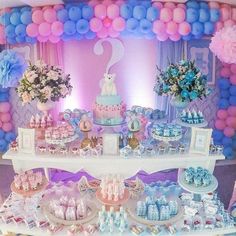 a dessert table filled with lots of treats