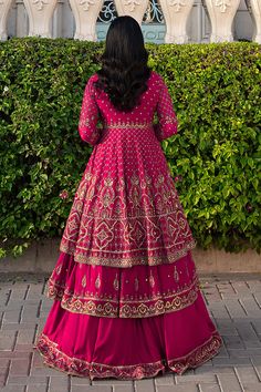 Shocking Pink Pakistani Wedding Dress Double Layered Frock with Lehenga comes with Pakistani raw silk tunic which is embellished with embroidered borders and sequins. There is a richly embroidered dupatta which has sequin work on it. Detailed Description: SKU: WB420 Detailing: Embroidery, Motifs, Naqshi, Sequins, Tilla Color: Shocking Pink Fabric: Net, Tissue, Cotton Silk Design: Fully Embellished Dress with Embroidery, Goldwork Event: Bridal wear, Wedding Festive Anarkali Embellished Embroidered Dress, Semi-stitched Embellished Embroidered Dress For Festivals, Embellished Semi-stitched Embroidered Dress For Festivals, Festive Bollywood Embellished Embroidered Dress, Designer Anarkali Dress With Mirror Work, Embroidered Embellished Dress For Wedding And Diwali, Embroidered Dress For Wedding Diwali, Traditional Embellished Embroidered Dress For Designer Wear, Anarkali Embellished Sharara For Reception