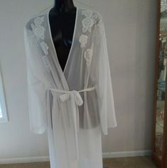 Beautiful Ivory Robe With Embroidered Flowers Across The Upper Bodice. Opaque Robe Has Attached Ties. 100% Polyester. Machine Wash In Warm Water At A Gentle Setting. Tumble Dry At Low Temperature. Iron At Low Setting. Do Not Use Bleach. Nwot Cream V-neck Sleepwear For Wedding Night, White Lace Robe For Daywear, White Sheer Robe For Daywear, White Lace Long Sleeve Sleepwear, Cream Lace Trim Robe For Daywear, White Delicate Lace Robe, White Lace Robe With Delicate Details, V-neck Robe With Lace Trim For Daywear, Sleepwear Robe