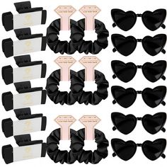 black and white hair clips with tags attached to each one's ears, all in different styles