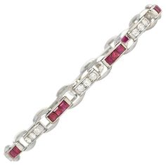 Cartier Art Deco Calibré Ruby and Diamond Bracelet in Platinum | From a unique collection of vintage Link Bracelets at https://www.1stdibs.com/jewelry/bracelets/link-bracelets/. Cartier Fine Jewelry Bracelet With Diamond Accents, Cartier Brilliant Cut Diamond Bracelet, Cartier Fine Jewelry Diamond Bracelet With Brilliant Cut, Cartier Diamond Bracelet With Brilliant Cut, Cartier White Gold Diamond Bracelet With Accents, Classic Cartier Diamond Bracelet With Accents, Classic Cartier Diamond Bracelet With Diamond Accents, Cartier Classic Diamond Bracelet With Diamond Accents, Cartier Single-cut Diamond Bracelets