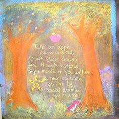 a painting with words written on it and two trees in the background that are painted orange