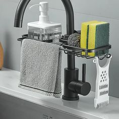 a bathroom sink with soap, sponges and other items on it